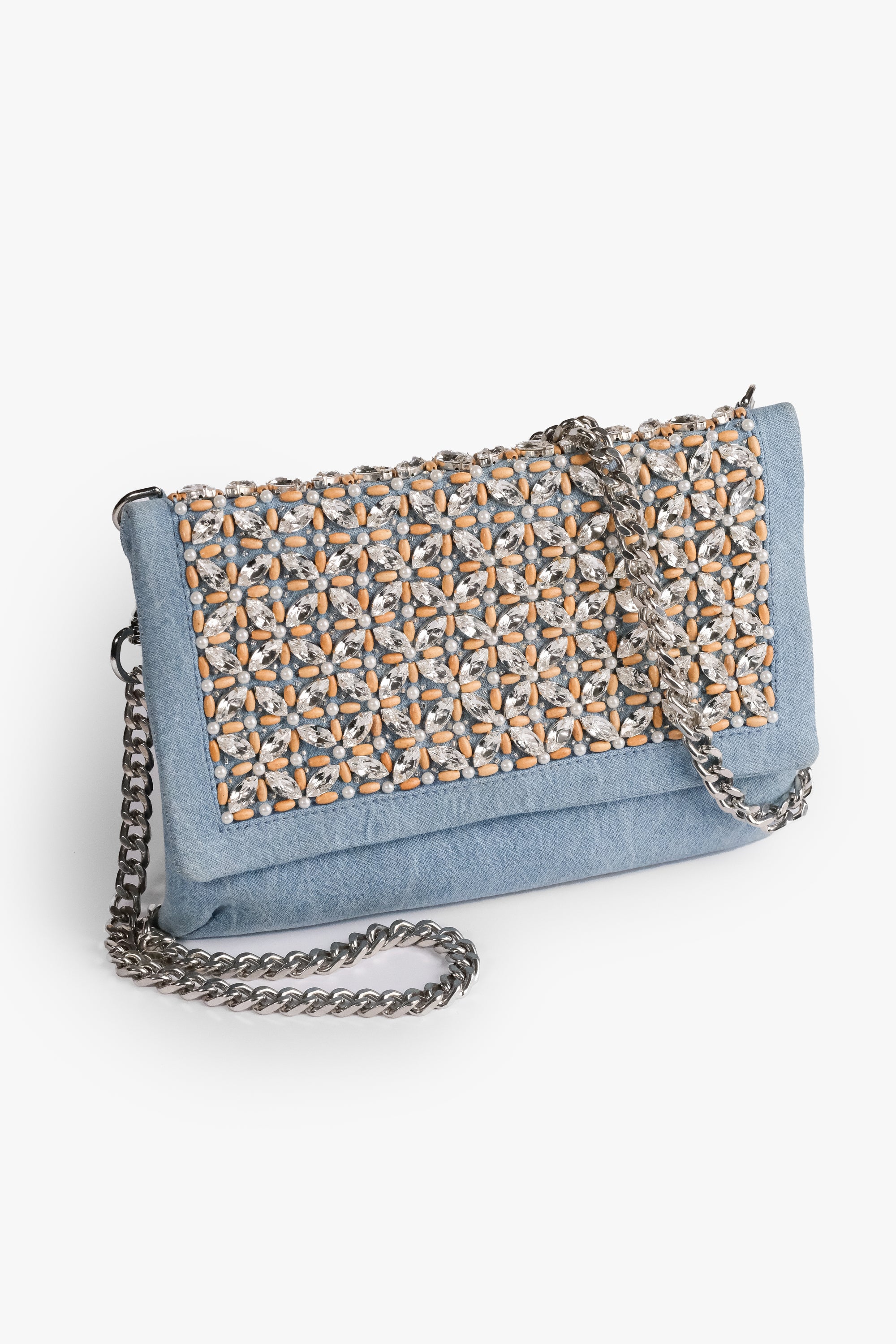 Acambha's Crystal Bead Glam Clutch  features delicate crystal beading, pearls, and wooden beads, with a zipper and magnet button on the flap. This clutch showcases meticulous craftsmanship.