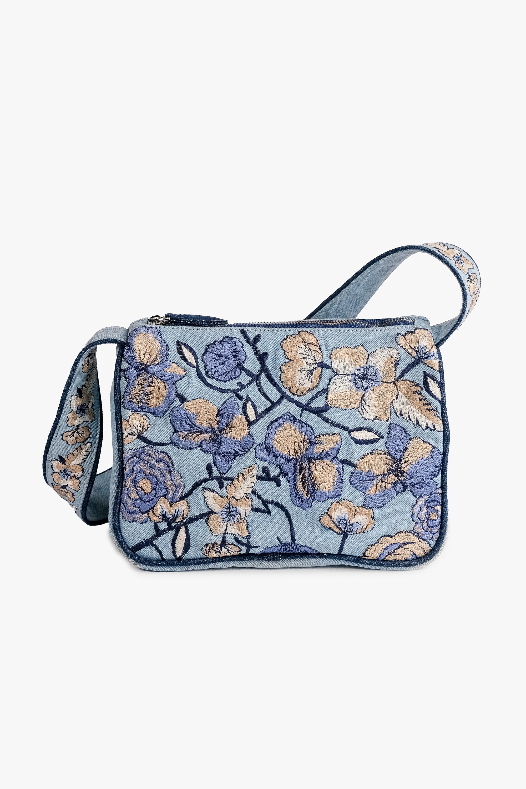 Acambha's Embroidered Denim Shoulder Bag, featuring multi-colored embroidery on light denim. Meticulous craftsmanship, extending from the body to the strap. Framed with dark blue piping.